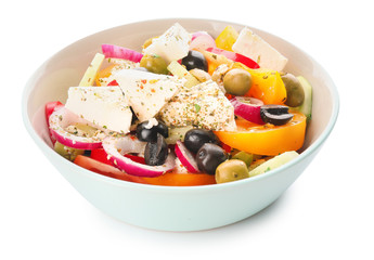 Bowl with fresh Greek salad on white background