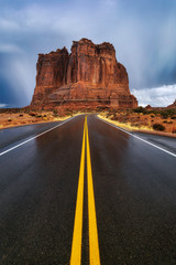 Fototapeta na wymiar Paved Road Leading through Arches National Park in Moab Utah