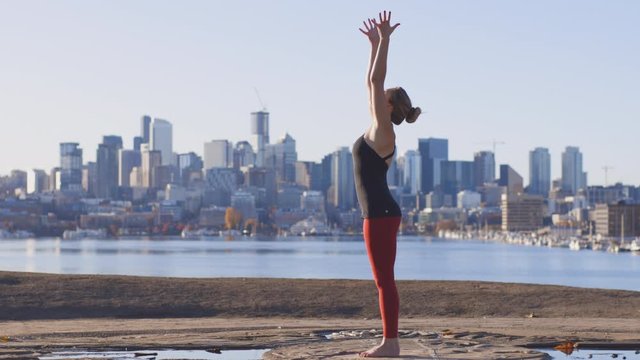 Breathing Exercise Back Bend Yoga Pose By Fit Woman in City Landscape