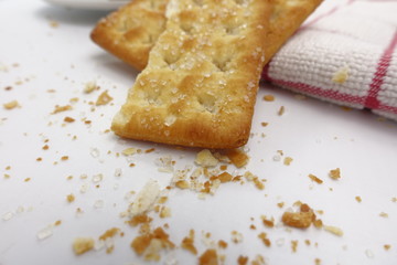 Cracker with coffee cup on white background