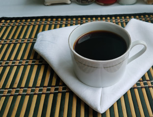 Cup of coffee on wooden table