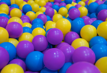Fototapeta na wymiar Colored plastic balls on children's playground