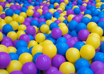 Fototapeta na wymiar Colored plastic balls on children's playground