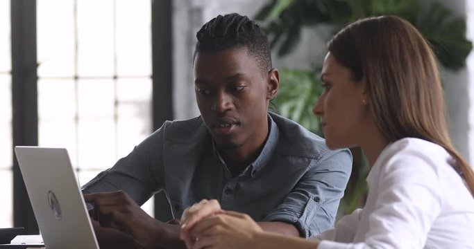 African it administrator explain corporate software usage consult caucasian worker