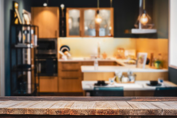 Wood table with blur kitchen room background .For montage product display or design key visual layout.
