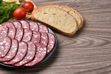 Sliced smoked sausage on a plate