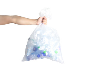 A man holds a Plastic bag with used plastic drinking bottles for recycling.