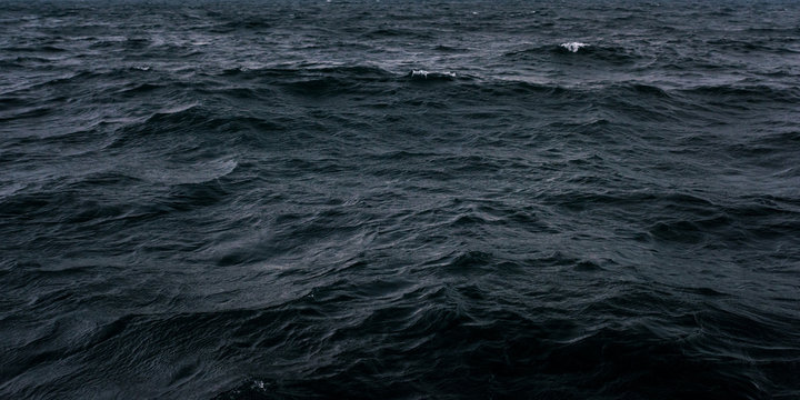 Dark and blue sea water surface