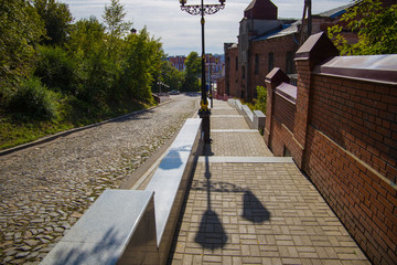city street lamp on the background of paving stones at sunset