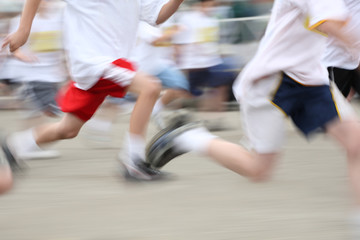 Naklejka premium Children running a marathon, motion blurred image
