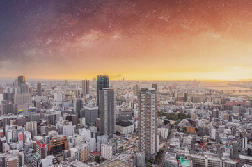 Osaka city, Business district in Japan at sunrise with starry sky. City background
