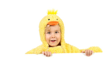 Young smiling boy in a baby chick costume with room for text below