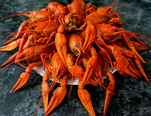A large portion of boiled crayfish on a plate.