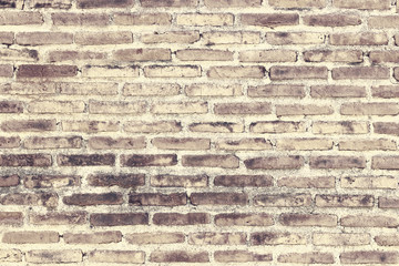Weathered stained old brick wall background