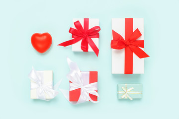 Valentine's Day background. Gifts, red heart, on pastel blue background. Valentines day concept.