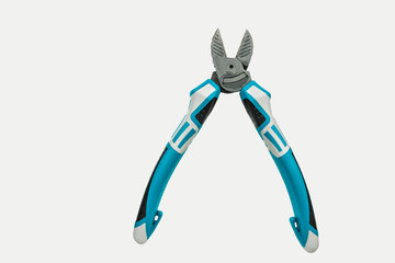 Side cutter electrician on a white background, close-up.