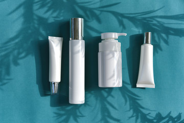 Cosmetic bottle containers packaging with leaves shadow and light effect, Blank label for organic...