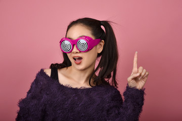 Asian woman hand finger point presenting product for advertising, Happiness girl wearing funny...