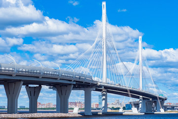 Obraz premium Saint Petersburg. Russia. Bridges Of Petersburg. Obukhov bridge against the blue sky and clouds. Panorama of cable-Stayed bridge in St. Petersburg. View of the city on a summer day. Travel to Russia.