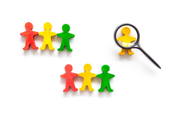 Tolerance concept. Social research. eople cutouts under magnifier on white background top-down