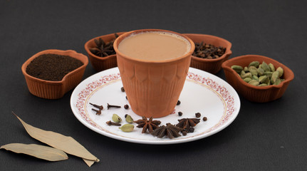 Indian Popular Drink Masala Chai or Masala Tea With Traditional Beverage on Black Background