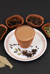 Indian Popular Drink Masala Chai or Masala Tea With Traditional Beverage on Black Background
