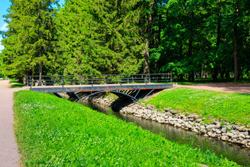 Metal bridge across Fish channel in the Catherine Park in Tsarskoye Selo, Pushkin, Russia