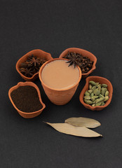 Obraz na płótnie Canvas Indian Popular Drink Masala Chai or Masala Tea With Traditional Beverage on Black Background