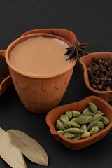 Indian Popular Drink Masala Chai or Masala Tea With Traditional Beverage on Black Background
