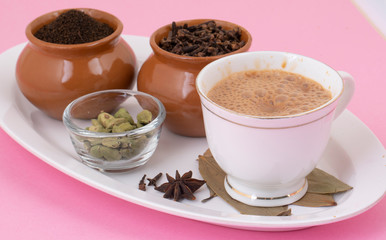Indian Popular Drink Masala Chai or Masala Tea With Traditional Beverage on Pink Background