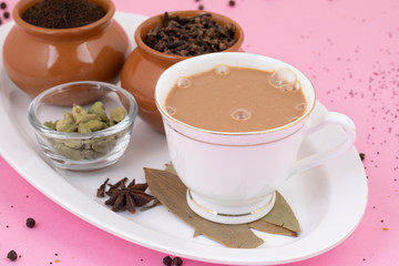 Indian Popular Drink Masala Chai or Masala Tea With Traditional Beverage on Pink Background