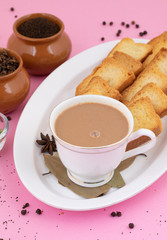Indian Popular Drink Masala Chai or Masala Tea With Traditional Beverage on Pink Background
