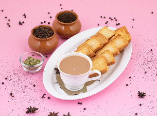 Indian Popular Drink Masala Chai or Masala Tea With Traditional Beverage on Pink Background