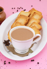 Indian Popular Drink Masala Chai or Masala Tea With Traditional Beverage on Pink Background