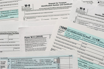 Fototapeta premium Paper blanks of 1040, w4 and w9 tax form close up
