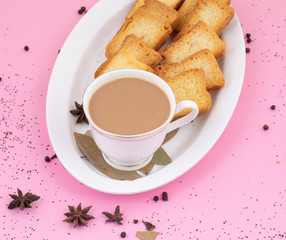 Indian Popular Drink Masala Chai or Masala Tea With Traditional Beverage on Pink Background