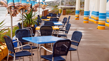 Wet Tables And Chairs At The Beach