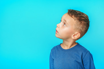 a model child posing on turquoise background