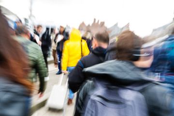 crowd of people in the city with motion blur