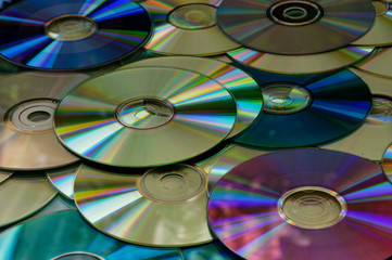 Compact discs lay in a pile