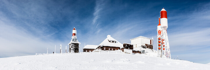 TV and radio antennas known as La Bola del Mundo in Navacerrada, Madrid, Spain, on a snow-covered mountain.