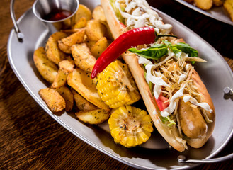 Hotdogs and French fries on a dishes. Fast food meal. Restaurant.