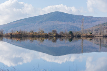 Blue beautiful autumn lake with reflection