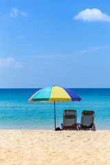 Relaxing at the beach, summer outdoor day light, Thailand holiday destination, colorful beach umbrella with beach chairs on the beach