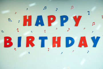 Happy Birthday alphabet text on wall background.