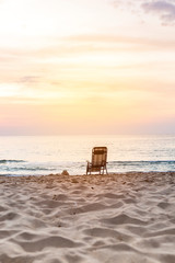 Sunset at the beach in southern Thailand, beach chair on the beach, holiday and vacation concept