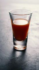 Bloody mary cocktail on a concrete dark table