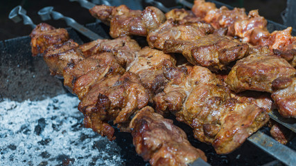 Juicy and tasty kebab grilled on coals, close-up. Bbq concept