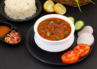 Rajma Chawal or Rajma Jeera Chawal (Rice) is a Traditional North Indian Food, Consisting of Cooked Red Kidney Beans in a Thick Gravy with Spices. Served with Jeera Rice