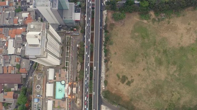 Top Down Aerial Aerial drone  view of Jakarta city skyscrapers during the afternoon under cloudy day. Wide shot on 4K DJI Mavic 2